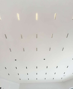 ceiling with multiple recessed linear lights installed in a grid pattern